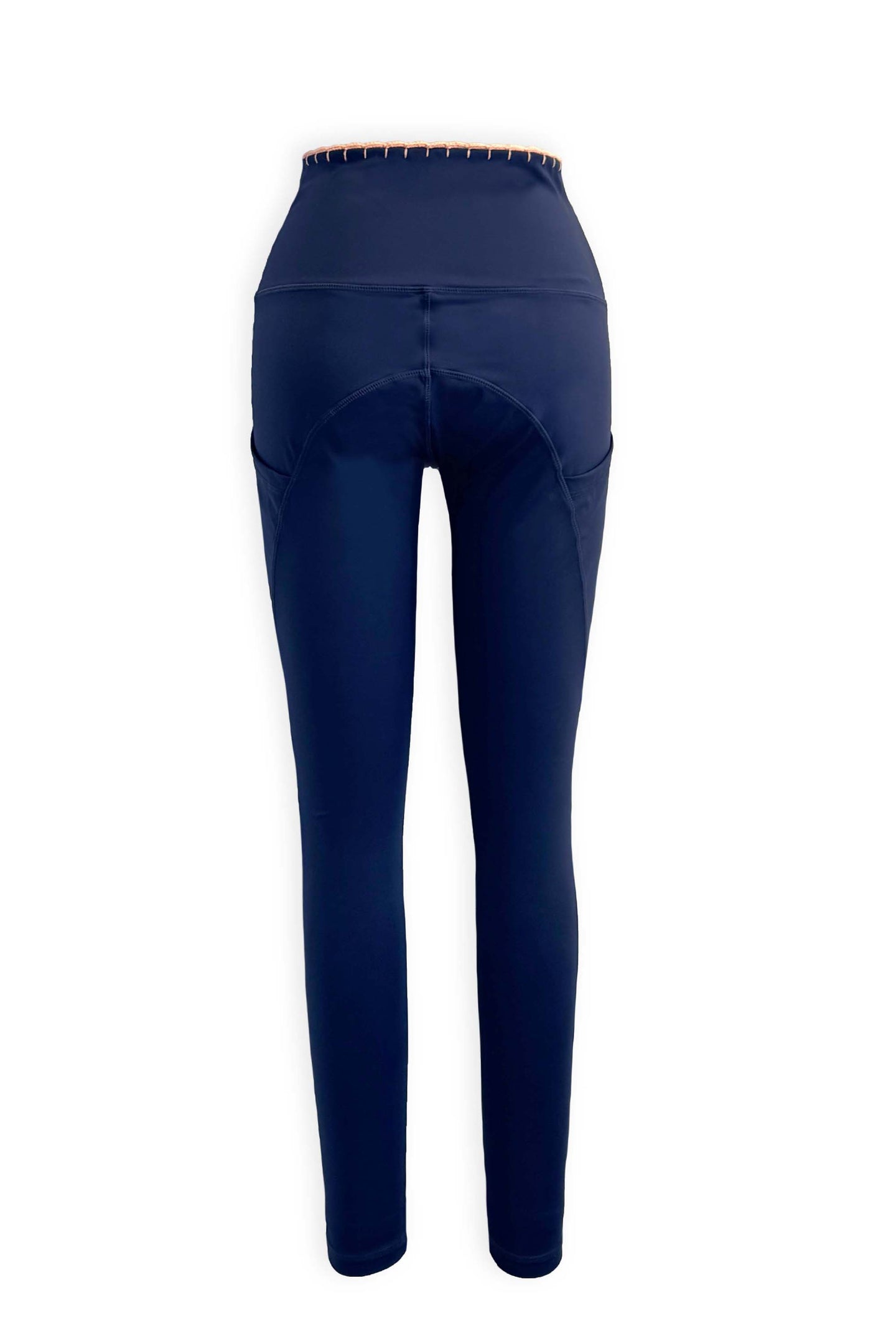These high waist compression leggings have moisture wicking sustainable fabric in our favorite shade of Navy. Featuring hand crocheted scalloped edges in the perfect peach.  Side pockets to store the essentials.